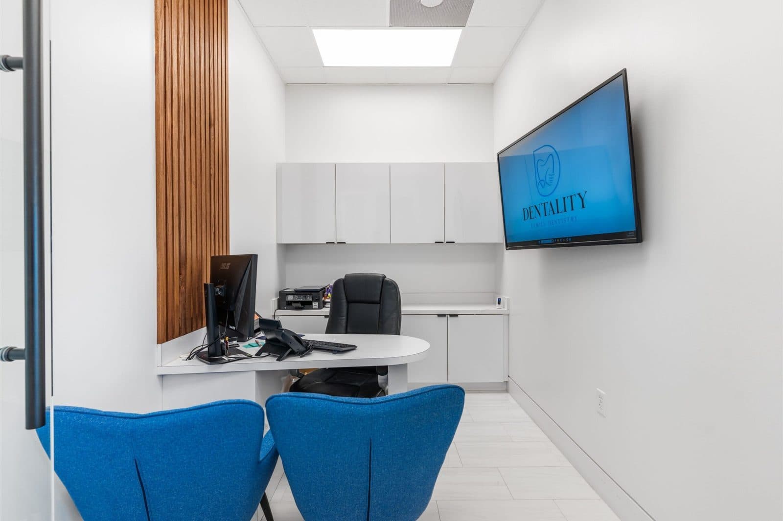 Private consultation room with a wall-mounted display