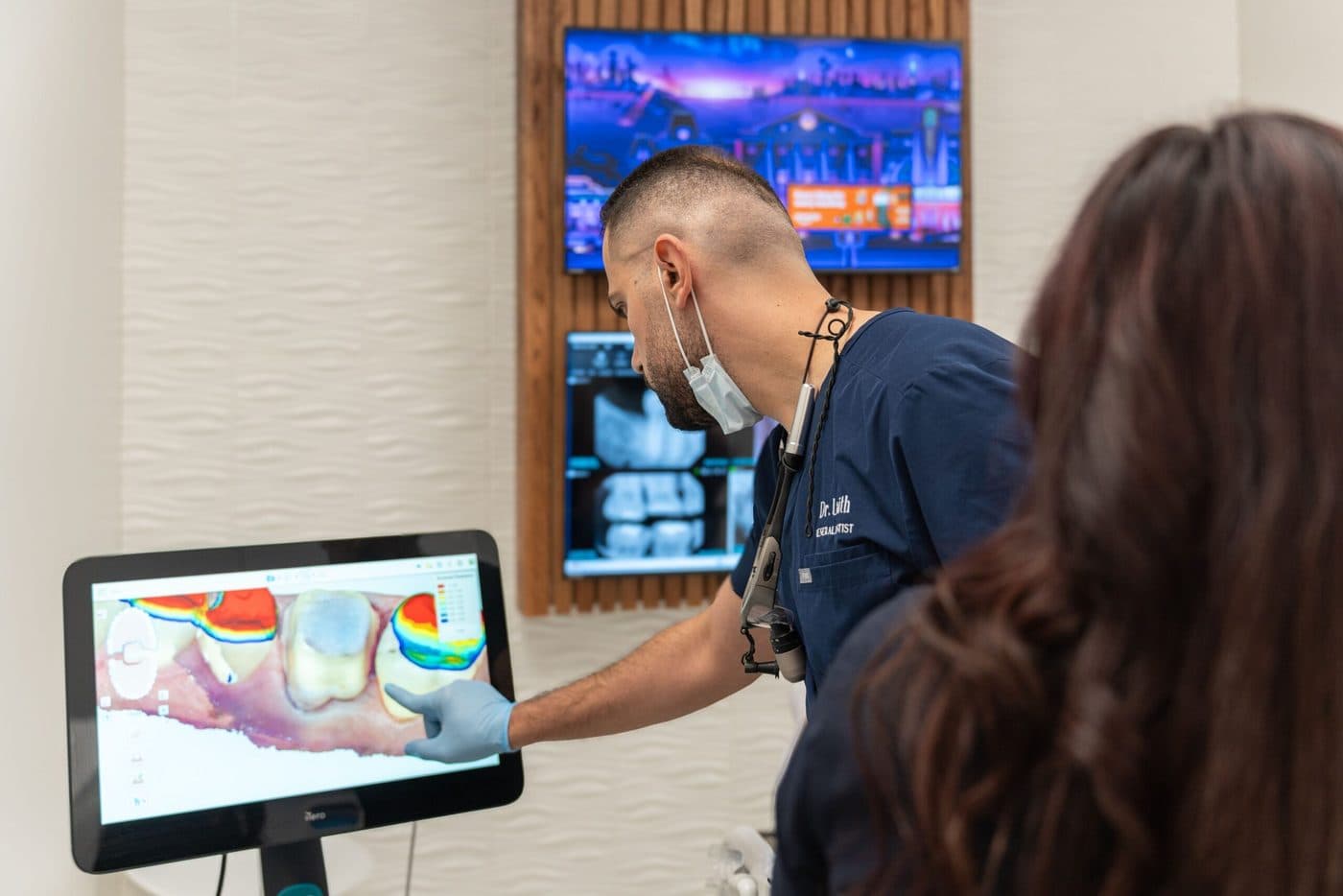 A Dentality dentist reviewing a 3D digital scan with a patient